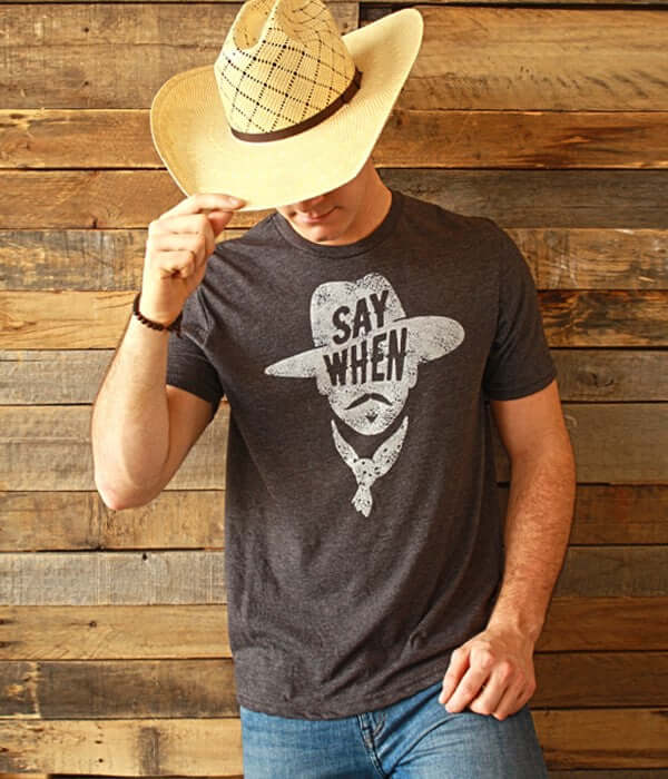 Say When Tombstone T-Shirt featuring a man wearing a cowboy hat and graphic print