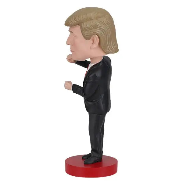 Trump Dance Bobblehead | Royal Bobbles showcasing Donald Trump's dance pose and signature suit on a red base.