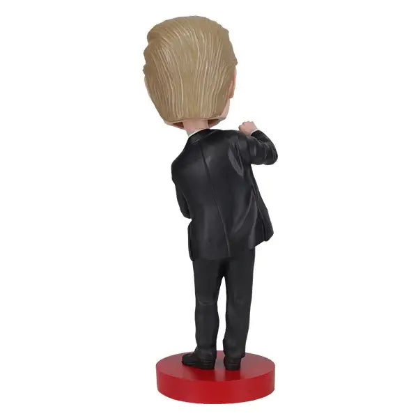 Trump Dance Bobblehead | Royal Bobbles showcases the back view of Trump's dance pose in a stylish suit.